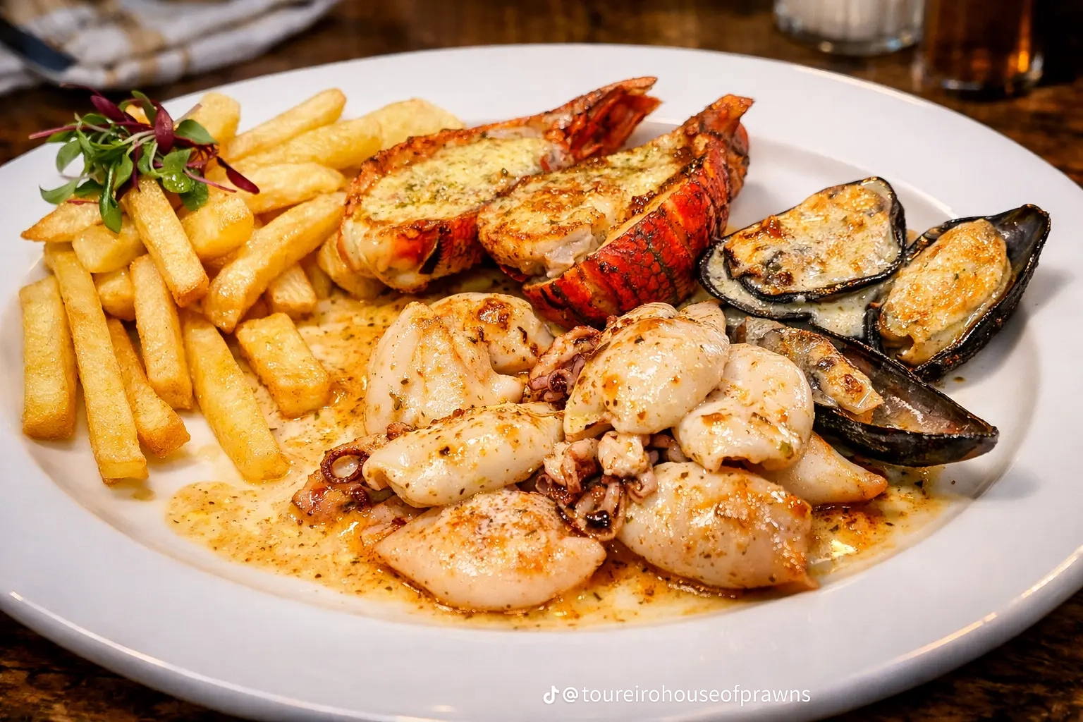 Seafood platter with calamari, prawns, mussels and fries
