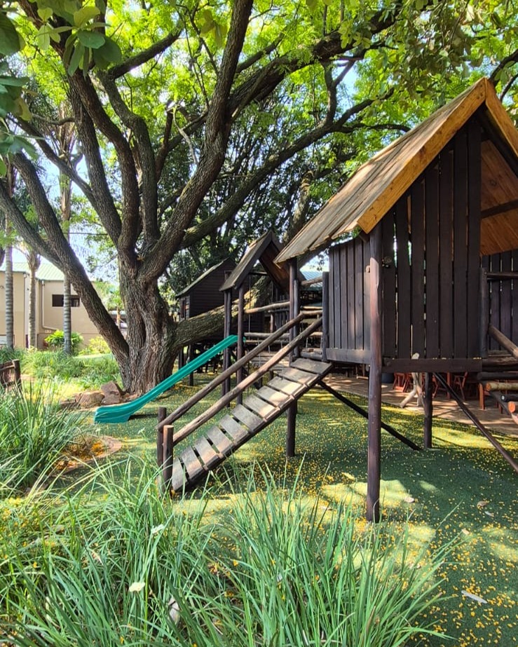 The thatched lapa surrounded by greenery